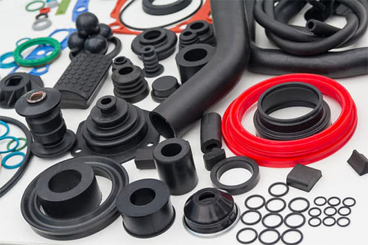 variety of injection rubber molded parts that are different shapes, sizes, and colors